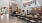 community room with a fireplace, long tables and chairs