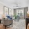 living room with a couch and chairs