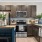 kitchen with a bar and stainless steel appliances 