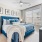 bedroom with nightstands on each side of the bed and a large window