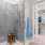 glass shower with a stool inside