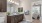 bathroom with a large mirror and toilet