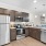 kitchen with a bar and stainless steel appliances 