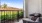 patio with two chairs and a table