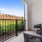 patio with two chairs and a table