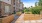 outdoor garden area with wooden plant boxes