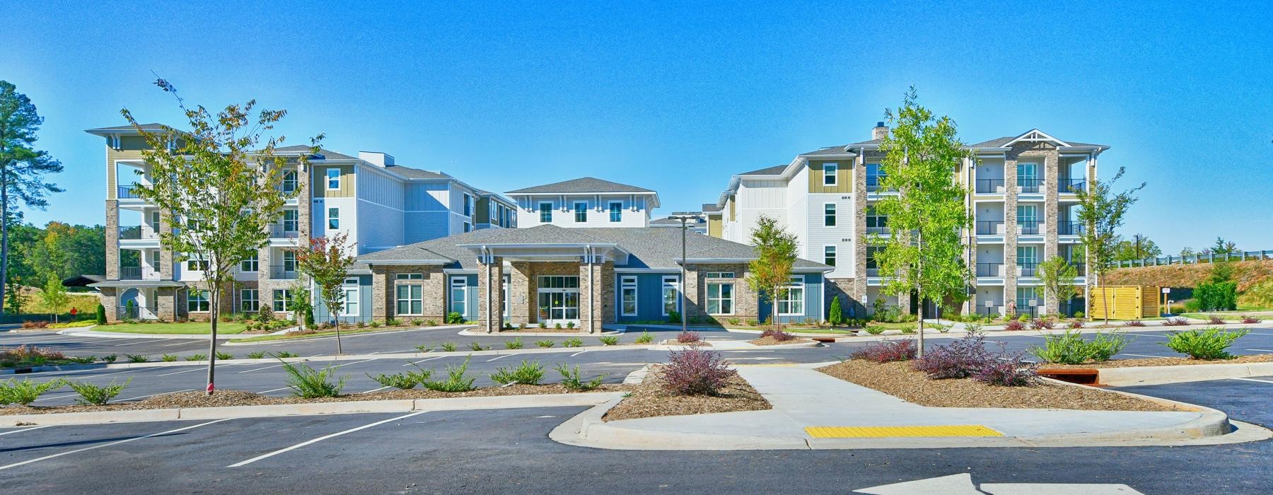 a building with trees and grass