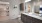 Model bathroom at Rosalia Verdae senior living apartments in Greenville, SC, featuring wood grain floor paneling.