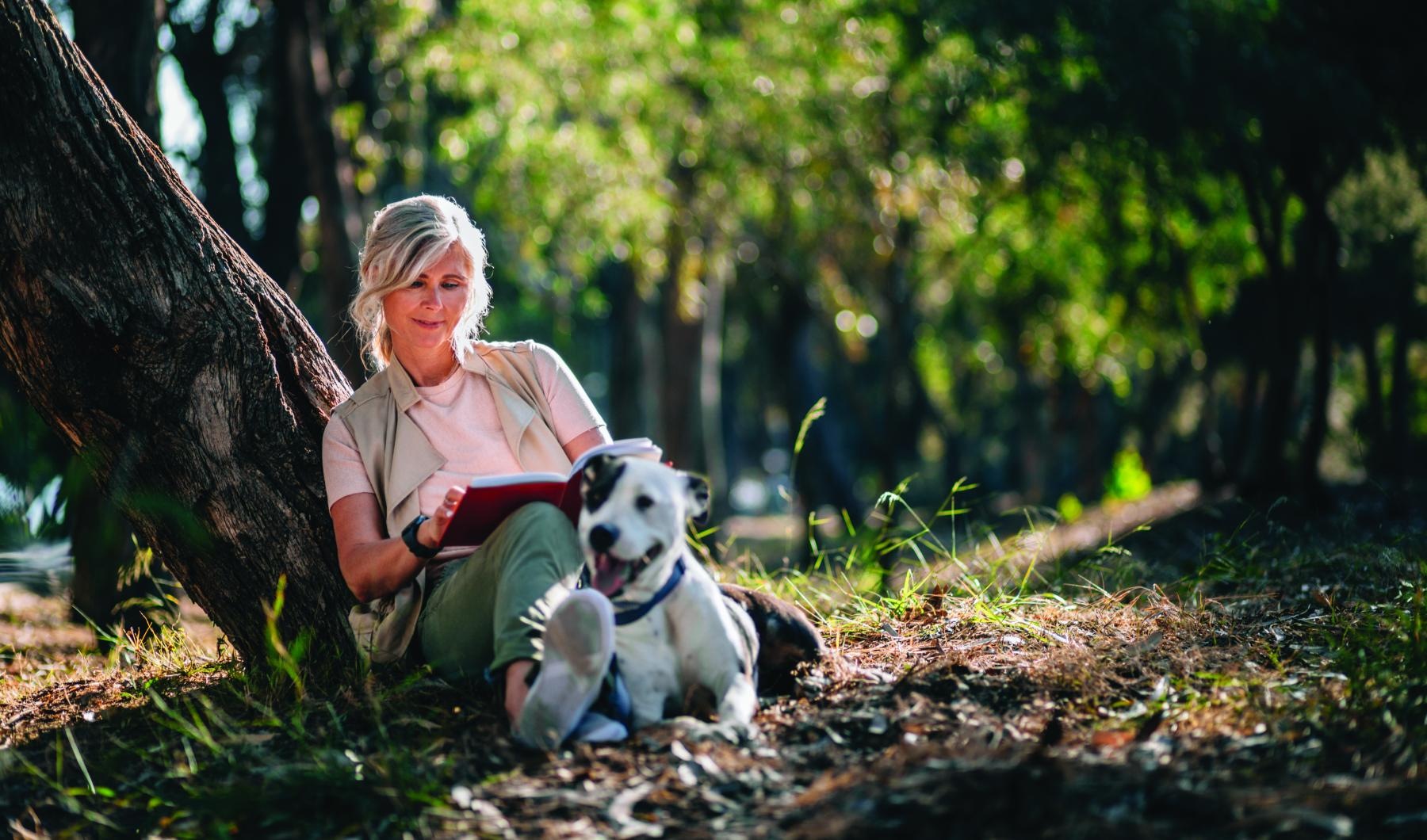Rosalia Verdae is a pet-friendly community! a person sitting next to a dog
